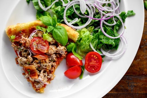 Pizza and salad on a plate 